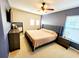 Bedroom featuring a gray accent wall, and a large bed at 1427 Hillview Ln, Tarpon Springs, FL 34689