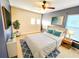 Bedroom featuring blue accent wall, decor and a large bed at 1427 Hillview Ln, Tarpon Springs, FL 34689