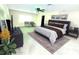 Spacious bedroom featuring decor, carpet, and natural lighting at 1427 Hillview Ln, Tarpon Springs, FL 34689