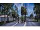 Gated community entrance featuring secure access and well-maintained landscaping at 1427 Hillview Ln, Tarpon Springs, FL 34689