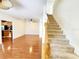 Open-concept living area blends seamlessly with the staircase, dining area, and kitchen, creating a spacious and inviting atmosphere at 1427 Hillview Ln, Tarpon Springs, FL 34689