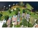 Aerial view of homes on waterfront properties featuring luscious, mature landscaping and private docks at 14808 Lake Magdalene Cir, Tampa, FL 33613
