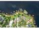 Panoramic aerial shot displays lakefront homes with docks and lush green landscapes at 14808 Lake Magdalene Cir, Tampa, FL 33613