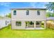 Two-story home with a spacious backyard, covered patio and neutral exterior paint at 14808 Lake Magdalene Cir, Tampa, FL 33613
