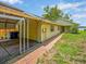 Charming home with a covered carport and brick walkway leading to a welcoming front porch at 14808 Lake Magdalene Cir, Tampa, FL 33613