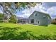 Green backyard featuring a fenced-in pool area and lush landscaping at 15309 Palomapark Ln, Lithia, FL 33547