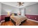 Comfortable bedroom featuring neutral colors, a ceiling fan, and natural lighting at 15309 Palomapark Ln, Lithia, FL 33547