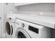 Functional laundry area with new washer and dryer and ample counter space at 15309 Palomapark Ln, Lithia, FL 33547