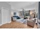 Spacious living room featuring hardwood floors, a ceiling fan, and lots of natural light at 15309 Palomapark Ln, Lithia, FL 33547