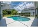 Enclosed pool with a spa and screened enclosure, perfect for year-round enjoyment at 15309 Palomapark Ln, Lithia, FL 33547