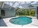 Beautiful pool with screened enclosure, offering a private outdoor retreat at 15309 Palomapark Ln, Lithia, FL 33547