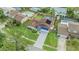 An aerial view of a beautiful home with a fenced-in pool and lush landscaping at 15609 Gardenside Ln, Tampa, FL 33624