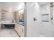 Beautifully remodeled bathroom featuring a clawfoot tub and a modern walk-in shower at 15609 Gardenside Ln, Tampa, FL 33624