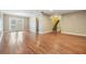 Bright living room with hardwood floors, French doors, and a view to the staircase at 15609 Gardenside Ln, Tampa, FL 33624