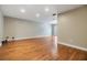 Spacious living room featuring hardwood floors and neutral paint scheme at 15609 Gardenside Ln, Tampa, FL 33624