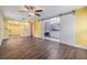 Main bedroom featuring hardwood floors, barn doors, and an attached bathroom at 15609 Gardenside Ln, Tampa, FL 33624