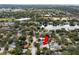 Charming home with in-ground pool and a spacious backyard, nestled in a lush, green neighborhood near the lake at 1579 Palmetto St, Clearwater, FL 33755