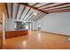 Bright living room features exposed wood beams, hardwood floors, and an open layout at 1579 Palmetto St, Clearwater, FL 33755