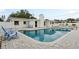A luxurious outdoor pool is surrounded by a deck and comfortable seating areas, ideal for relaxation at 1579 Palmetto St, Clearwater, FL 33755