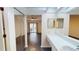 Bathroom featuring dual mirrors and sink with tile countertops, and views to a bedroom at 1712 Lake Cypress Dr # 1604, Safety Harbor, FL 34695