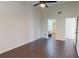 Open bedroom features hardwood floors and a connecting bathroom at 1712 Lake Cypress Dr # 1604, Safety Harbor, FL 34695