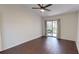 Vaulted bedroom features hardwood floors and sliding doors to a balcony at 1712 Lake Cypress Dr # 1604, Safety Harbor, FL 34695