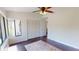 Cozy bedroom featuring wood flooring, ample natural light, and a spacious closet at 1712 Lake Cypress Dr # 1604, Safety Harbor, FL 34695