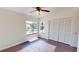 Bright bedroom with natural light, spacious closet, and stylish wood floors at 1712 Lake Cypress Dr # 1604, Safety Harbor, FL 34695