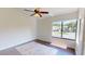 Bedroom filled with natural light with wood floors and a ceiling fan at 1712 Lake Cypress Dr # 1604, Safety Harbor, FL 34695