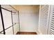 Walk-in closet with shelving and a view of the hardwood floor at 1712 Lake Cypress Dr # 1604, Safety Harbor, FL 34695