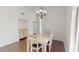 Bright dining room with a chandelier and wood floors offers a welcoming space for meals and gatherings at 1712 Lake Cypress Dr # 1604, Safety Harbor, FL 34695