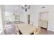 Dining room and living room with open floor plan and hardwood floors at 1712 Lake Cypress Dr # 1604, Safety Harbor, FL 34695
