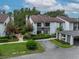 Charming townhome with a manicured lawn, colorful landscaping, and convenient covered parking at 1712 Lake Cypress Dr # 1604, Safety Harbor, FL 34695