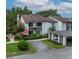 Aerial view of a townhouse with well-maintained landscaping and parking area at 1712 Lake Cypress Dr # 1604, Safety Harbor, FL 34695