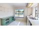 Bright kitchen space with backyard view, features an updated cabinet and sink with faucet at 1712 Lake Cypress Dr # 1604, Safety Harbor, FL 34695