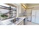 A sunlit kitchen showcasing a double sink and window with bright natural light at 1712 Lake Cypress Dr # 1604, Safety Harbor, FL 34695
