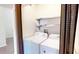 A laundry room featuring a washer and dryer with a curtain and metal shelving at 1712 Lake Cypress Dr # 1604, Safety Harbor, FL 34695