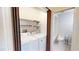 A laundry room featuring a washer and dryer with a curtain and metal shelving at 1712 Lake Cypress Dr # 1604, Safety Harbor, FL 34695