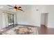 Bright living room features sliding glass doors to outdoor patio and a ceiling fan at 1712 Lake Cypress Dr # 1604, Safety Harbor, FL 34695
