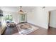 Bright living room featuring hardwood floors, ceiling fan, and sliding glass door at 1712 Lake Cypress Dr # 1604, Safety Harbor, FL 34695