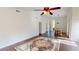 Open-concept living room with hardwood floors flows into dining area and kitchen at 1712 Lake Cypress Dr # 1604, Safety Harbor, FL 34695