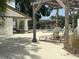 Resort style community pool with plenty of lounge chairs, shade, and ample seating for guests at 1712 Lake Cypress Dr # 1604, Safety Harbor, FL 34695