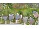 Expansive aerial view of property showing neighborhood, mature trees, and neighboring homes at 1717 Osprey Ln, Lutz, FL 33549