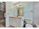 Bathroom with single sink vanity and tile walls at 1717 Osprey Ln, Lutz, FL 33549