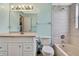 This bathroom features a single sink vanity, tub, and tile walls at 1717 Osprey Ln, Lutz, FL 33549