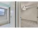 Bedroom and bathroom separated by a door at 1717 Osprey Ln, Lutz, FL 33549