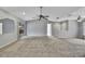 This large carpeted bedroom has access to other rooms at 1717 Osprey Ln, Lutz, FL 33549