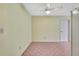 Dining area with tile flooring, white ceiling fan, and views of the kitchen at 1717 Osprey Ln, Lutz, FL 33549