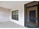 Front entrance with covered porch and front door at 1717 Osprey Ln, Lutz, FL 33549