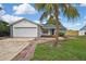 Charming single-Gathering home featuring a well-maintained yard and two-car garage at 1717 Osprey Ln, Lutz, FL 33549